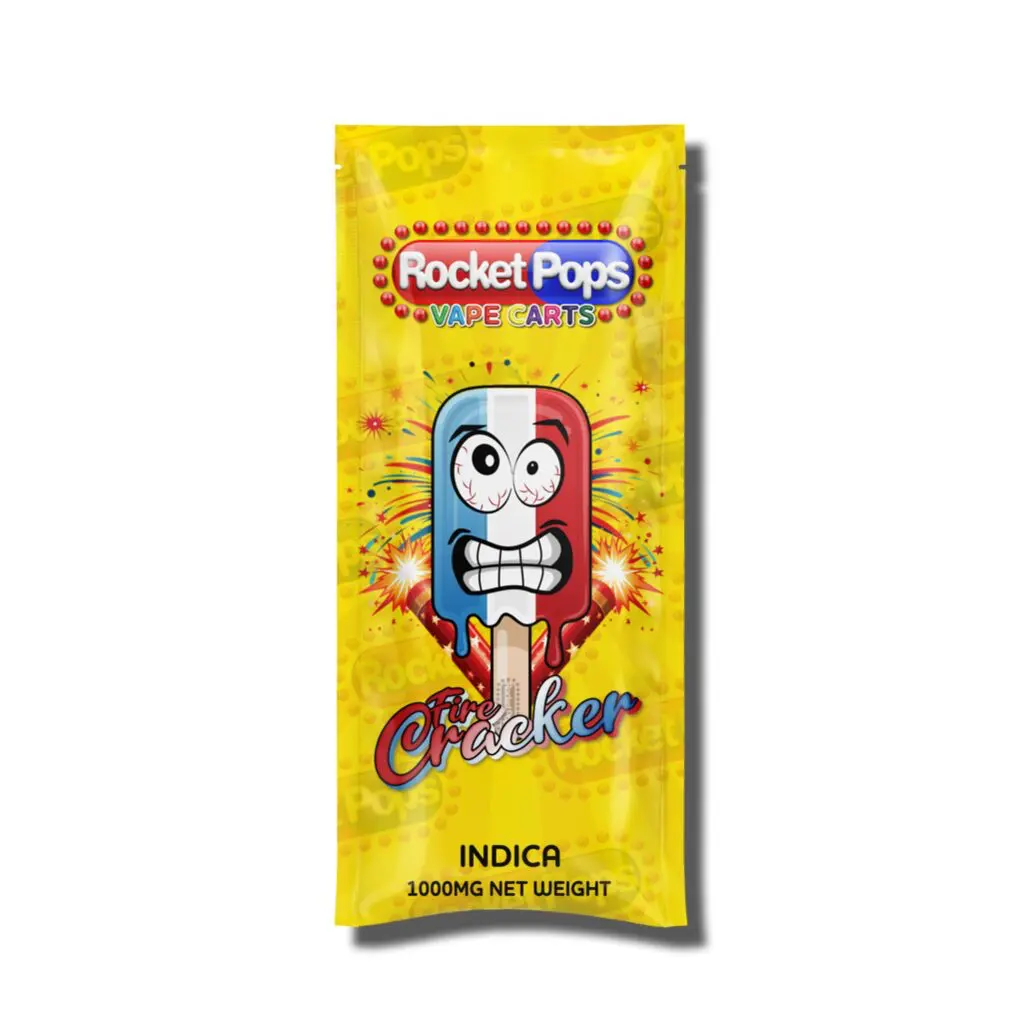 Bright yellow vape cart package labeled Rocket Pops Fire Cracker, Indica, 1000mg net weight (image of product)