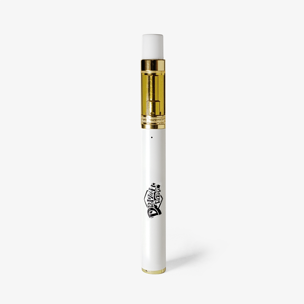 White vape pen with a gold-colored cartridge, standing upright on a white background.